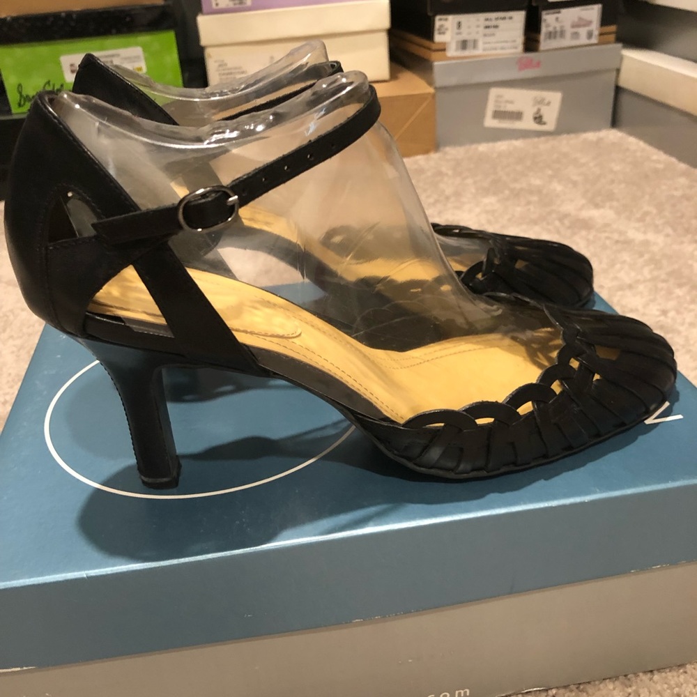 Black leather pump with cut outs and ankle strap